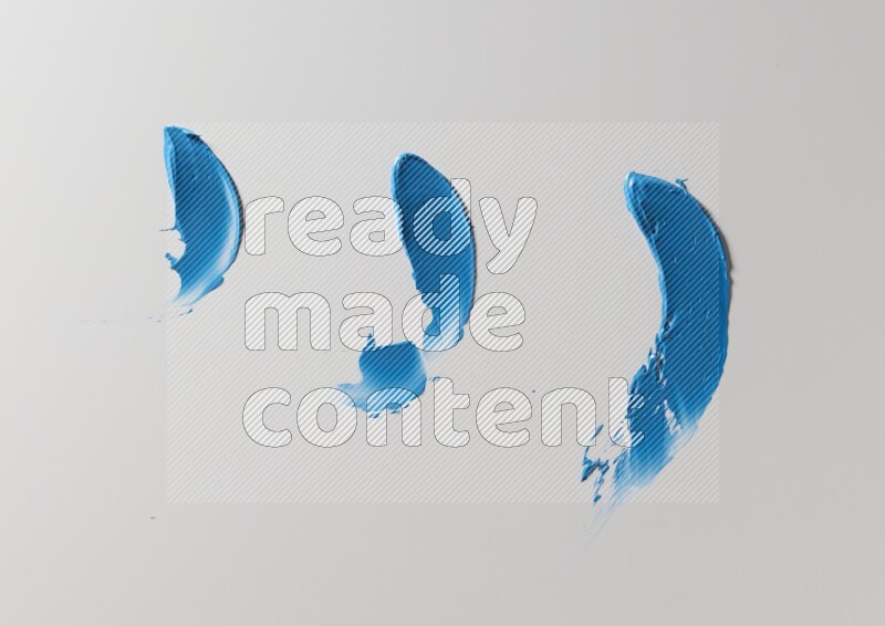 Blue painting knife strokes on white background
