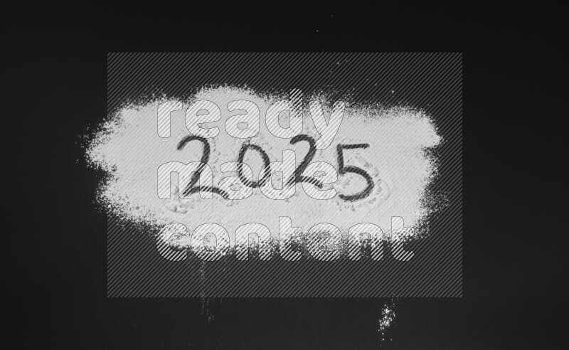 Numbers written with powder on black background