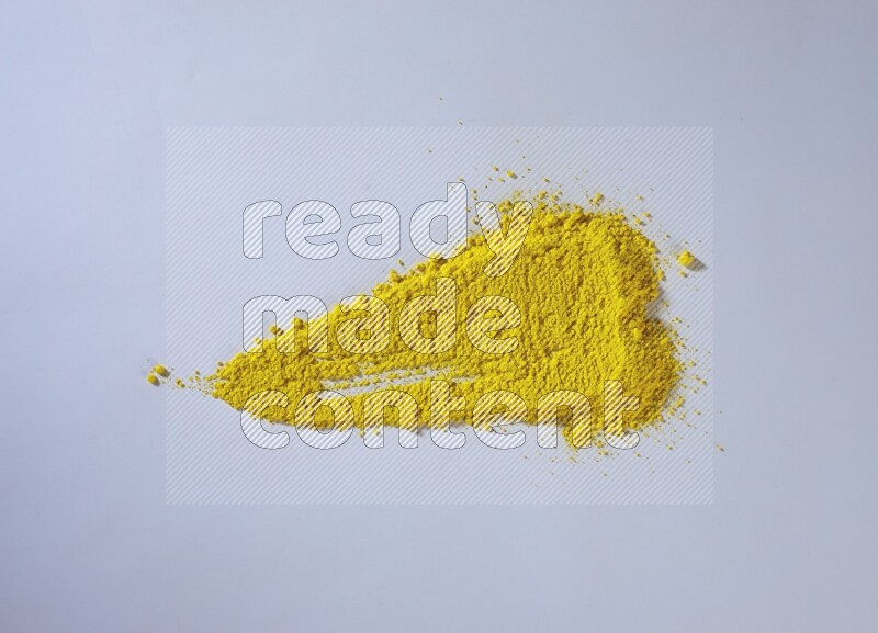 Yellow powder strokes on white background