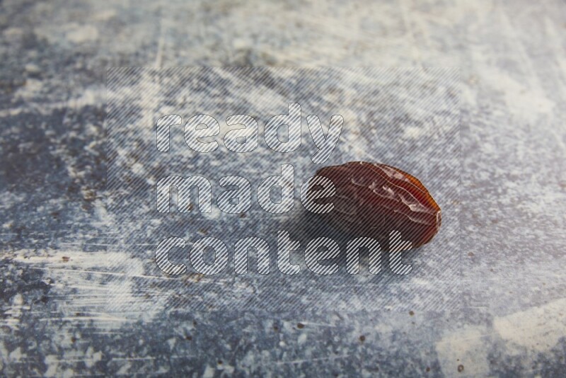 one madjoul date on a rustic blue backround