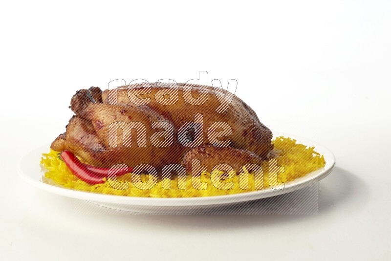 yellow  basmati Rice with  whole roasted chicken on a white rounded plate direct on white background