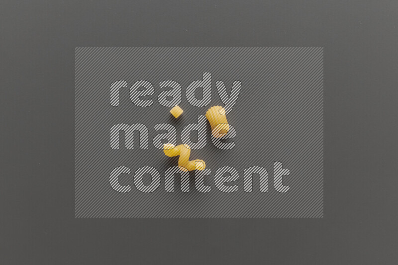 Different pasta types on grey background