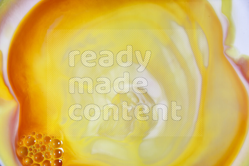 A close-up of abstract swirling patterns in orange, red and white