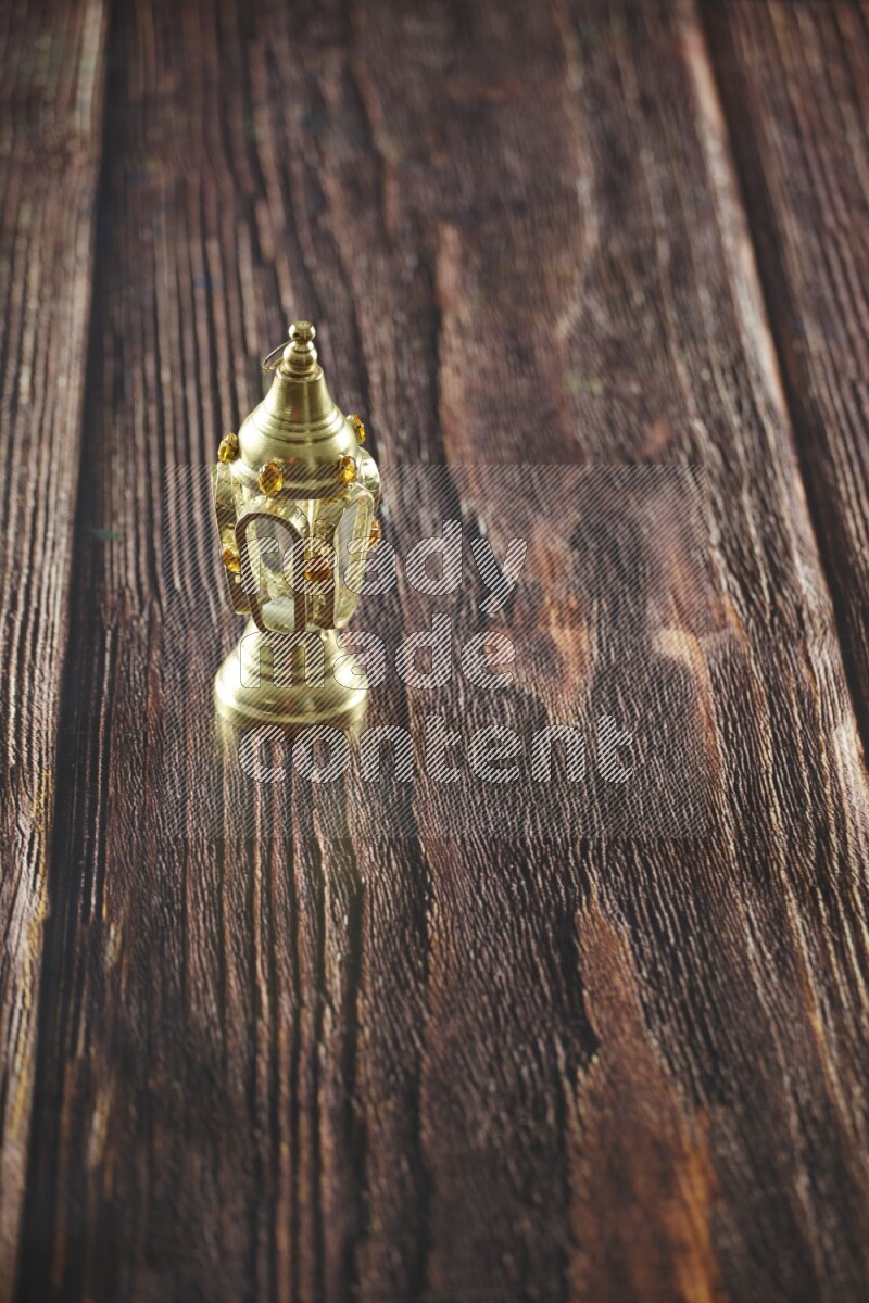 A lantern placed on a wooden background