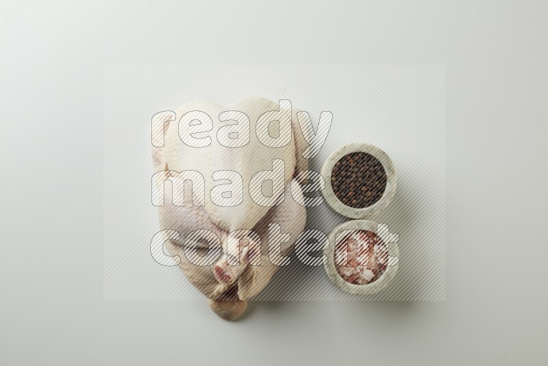 Whole fresh chicken direct on a white background