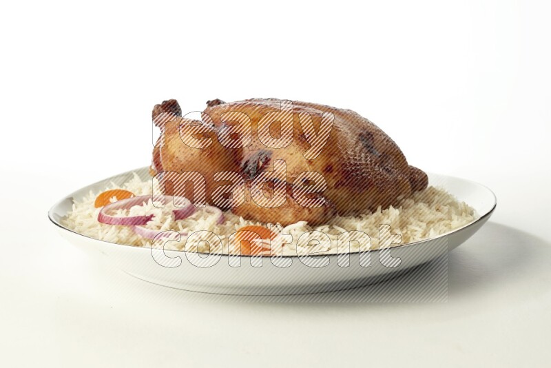 white  basmati Rice with  whole roasted chicken  on a white plate with a silver rim direct  on white background