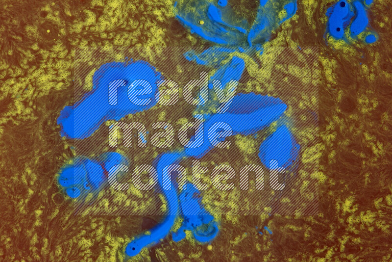 The image depicts a marbling effect with swirling patterns of red, blue and yellow