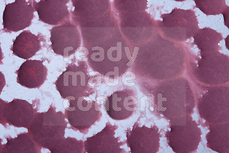 Close-ups of abstract purple paint droplets on the surface