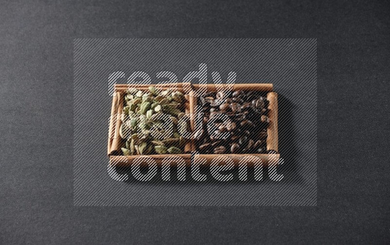 2 squares of cinnamon sticks full of coffee beans and cardamom on black flooring