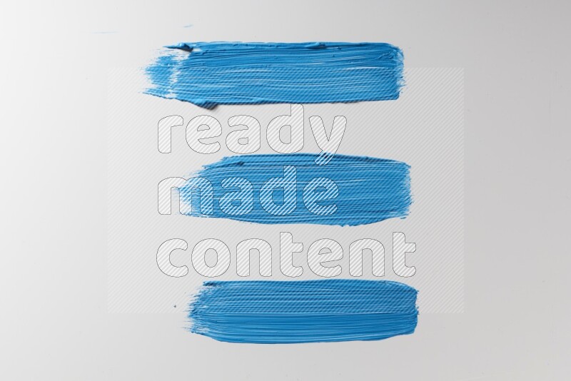Blue painting brush strokes on white background