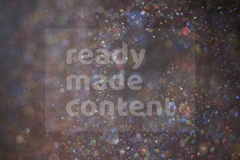 Multicolored glitter powder isolated on black background