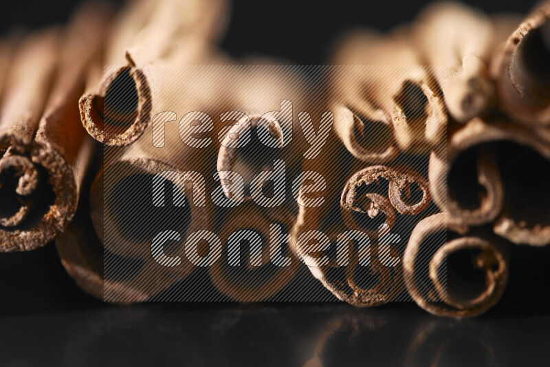 Cinnamon sticks on black background