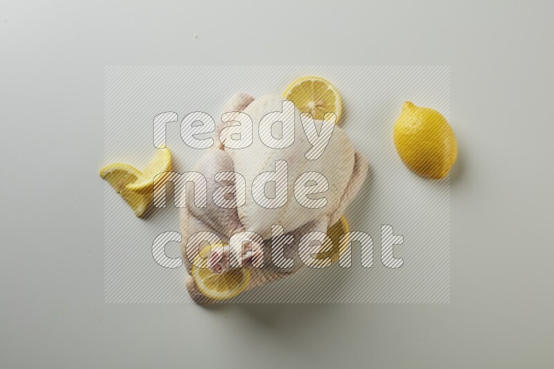 Whole fresh chicken direct on a white background